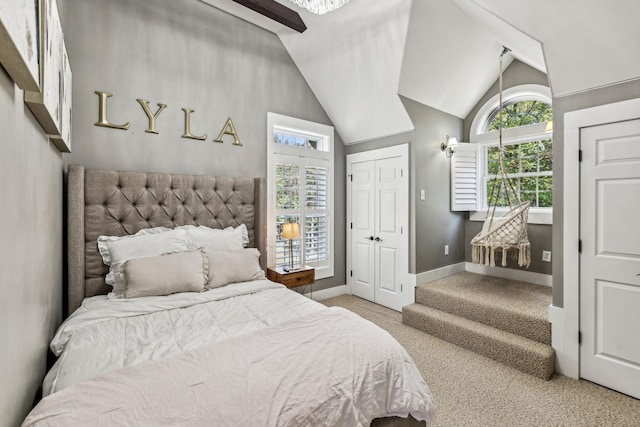 bedroom featuring carpet flooring and vaulted ceiling