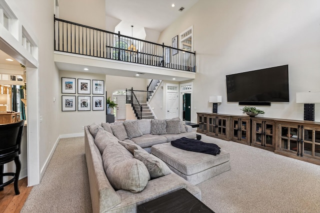 living room with a high ceiling