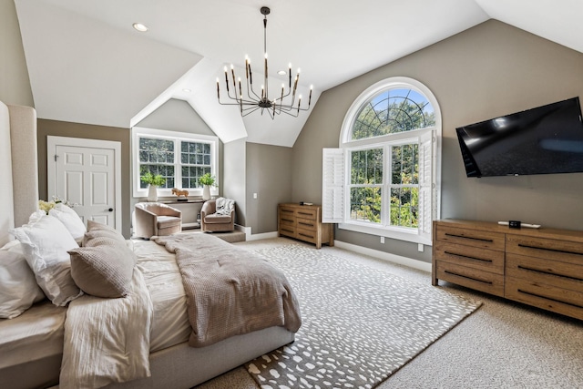 carpeted bedroom featuring a chandelier and lofted ceiling