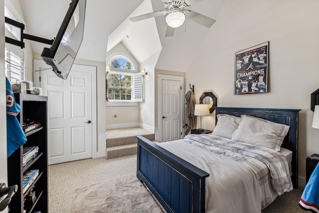 bedroom with ceiling fan, light colored carpet, lofted ceiling, and multiple windows