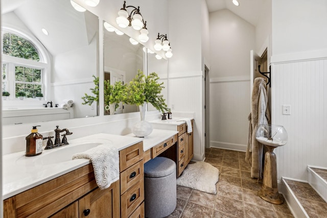 bathroom featuring vanity and vaulted ceiling