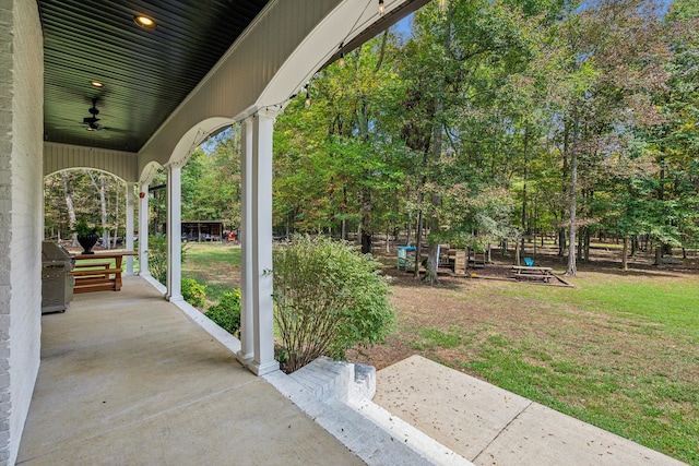 view of patio / terrace featuring a porch, ceiling fan, and a grill