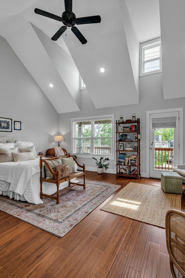 bedroom featuring access to exterior, ceiling fan, hardwood / wood-style floors, and multiple windows