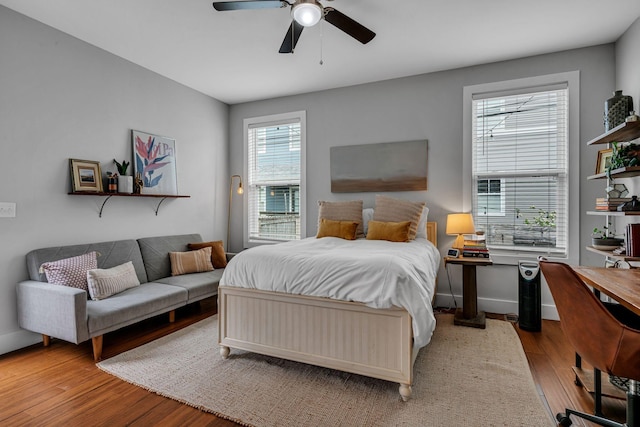 bedroom featuring light hardwood / wood-style floors and ceiling fan