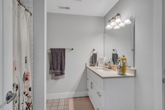 bathroom with a shower with curtain, tile patterned flooring, and vanity