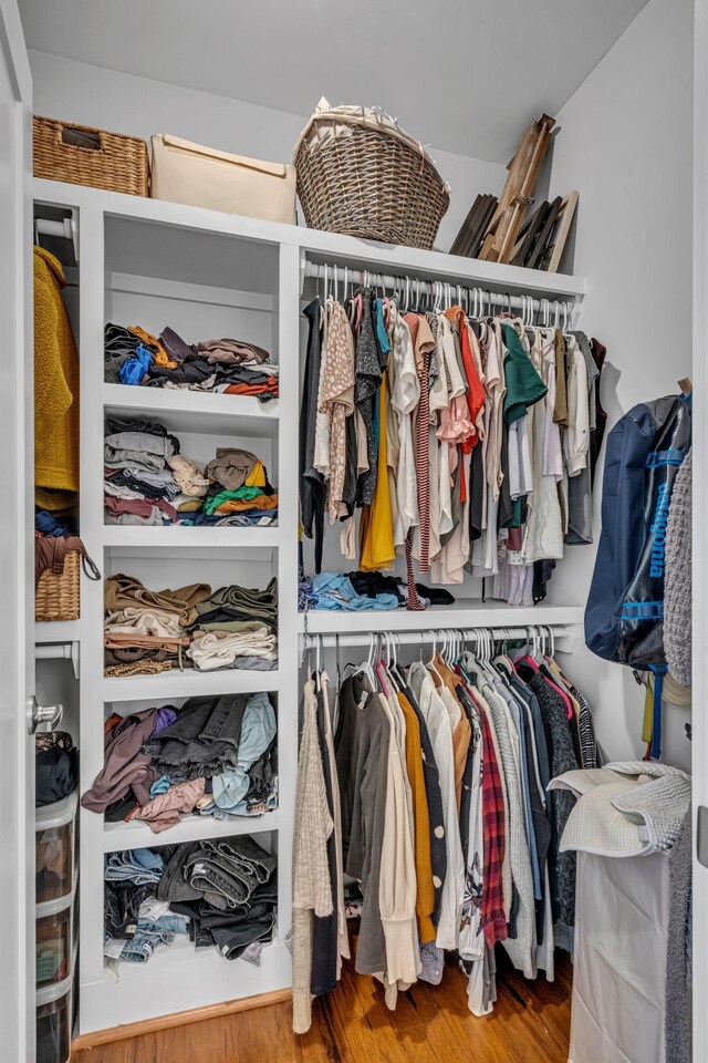 spacious closet featuring hardwood / wood-style floors