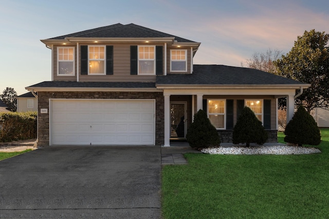 view of front facade featuring a yard and a garage