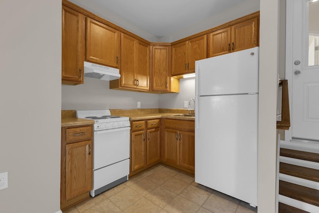 kitchen with white appliances and sink