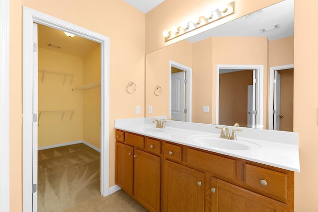 bathroom with tile patterned flooring and vanity