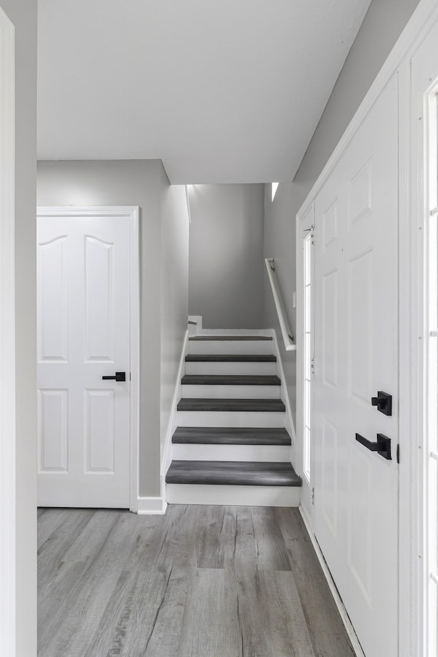 stairway featuring hardwood / wood-style flooring