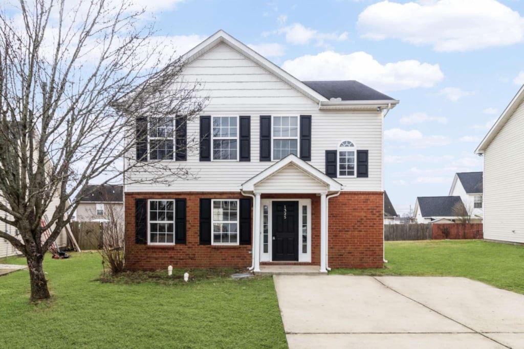 front facade with a front lawn