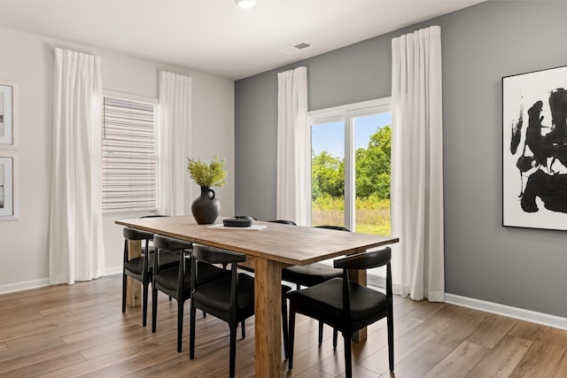 dining area with light wood-type flooring