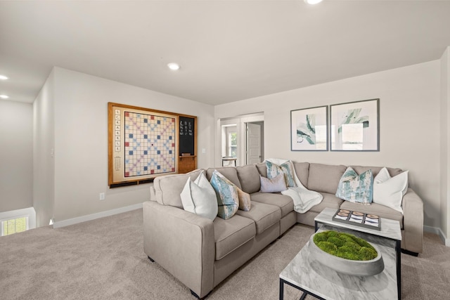 carpeted living room with a wealth of natural light