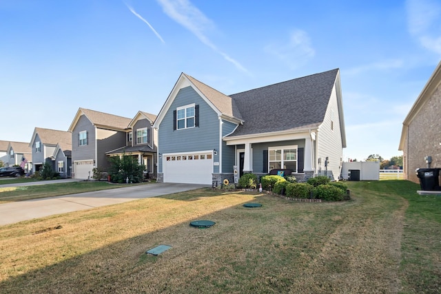 view of front of home with a garage and a front lawn