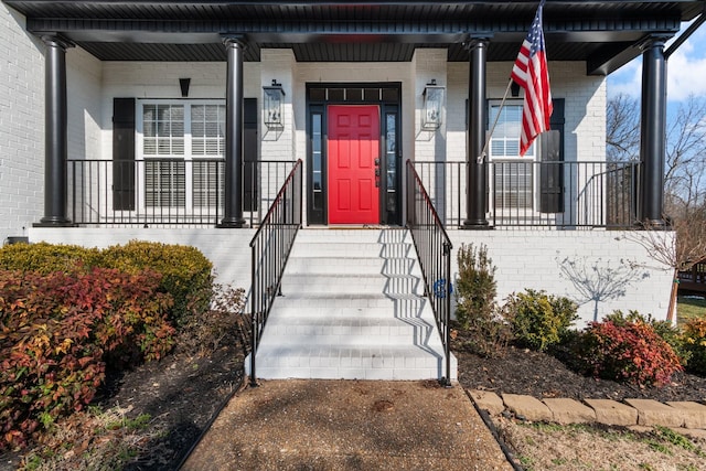 doorway to property with covered porch