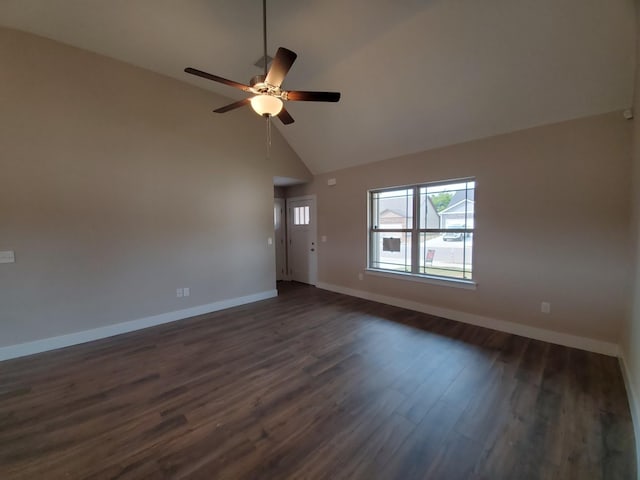 empty room with ceiling fan, dark hardwood / wood-style floors, and high vaulted ceiling