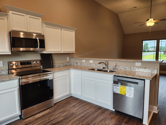 kitchen with white cabinets, appliances with stainless steel finishes, and sink