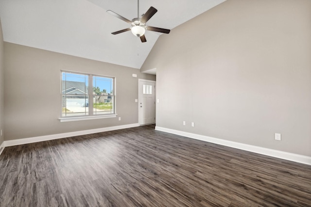 spare room featuring ceiling fan, dark hardwood / wood-style flooring, and lofted ceiling