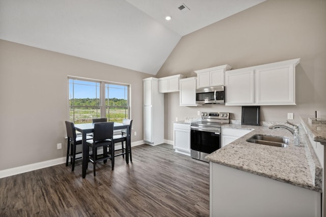 kitchen featuring light stone countertops, white cabinetry, stainless steel appliances, sink, and dark hardwood / wood-style floors