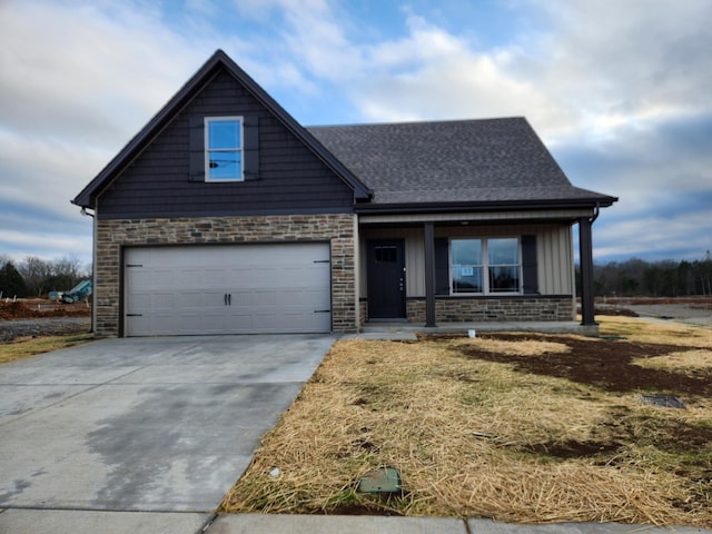 view of front facade featuring covered porch and a garage