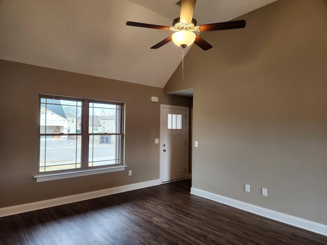 interior space with ceiling fan, dark hardwood / wood-style flooring, and high vaulted ceiling