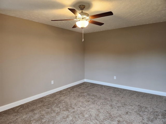 spare room with carpet, ceiling fan, and a textured ceiling