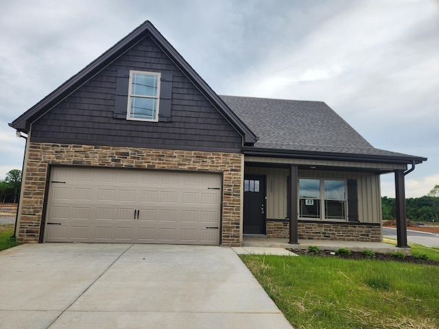 view of front of house with covered porch and a garage