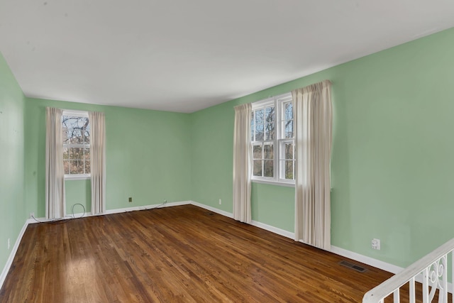 empty room featuring hardwood / wood-style flooring