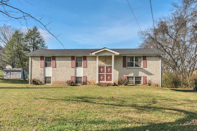 bi-level home with a storage unit and a front lawn