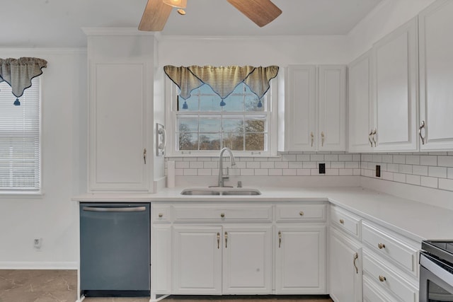 kitchen featuring dishwasher, backsplash, white cabinets, sink, and range