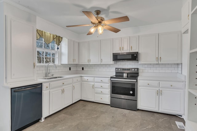 kitchen featuring stainless steel appliances, white cabinetry, and sink