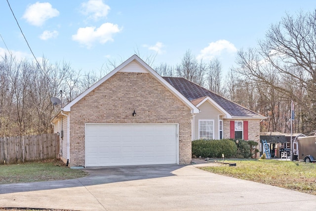 view of front facade with a front yard and a garage