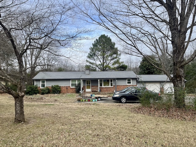 single story home with a porch and a front lawn