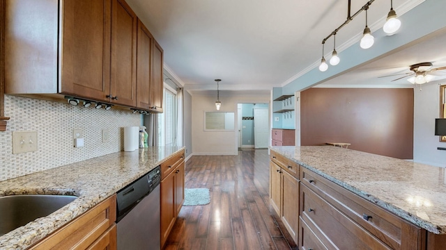 kitchen with dishwasher, tasteful backsplash, brown cabinetry, and dark wood finished floors