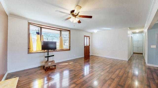 unfurnished living room featuring a ceiling fan, baseboards, ornamental molding, and hardwood / wood-style floors