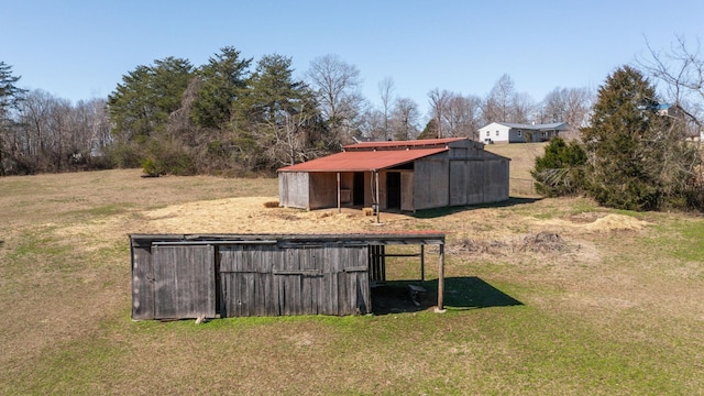 view of pole building with a yard