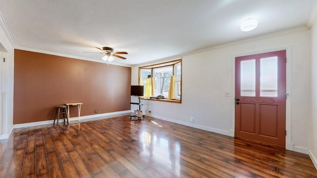 foyer entrance with ceiling fan, crown molding, baseboards, and wood finished floors