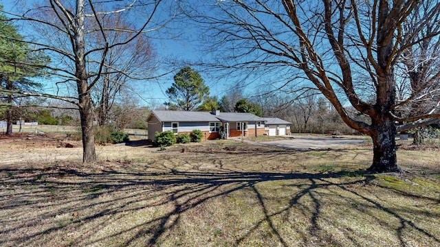 view of front of home with a garage and driveway