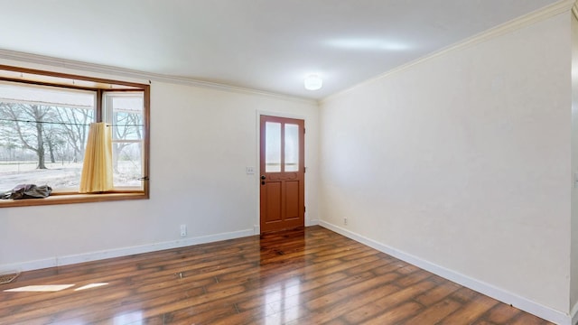 foyer entrance with dark wood-type flooring, visible vents, crown molding, and baseboards