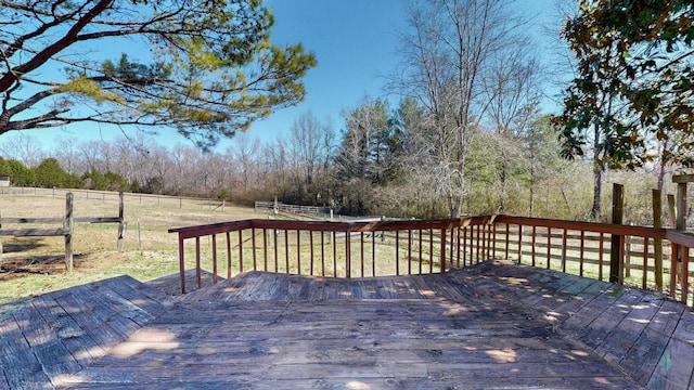 wooden terrace featuring fence