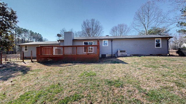 back of house with a yard, a chimney, crawl space, fence, and a deck