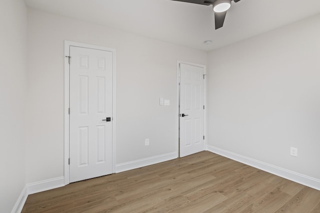 unfurnished room featuring ceiling fan and light wood-type flooring