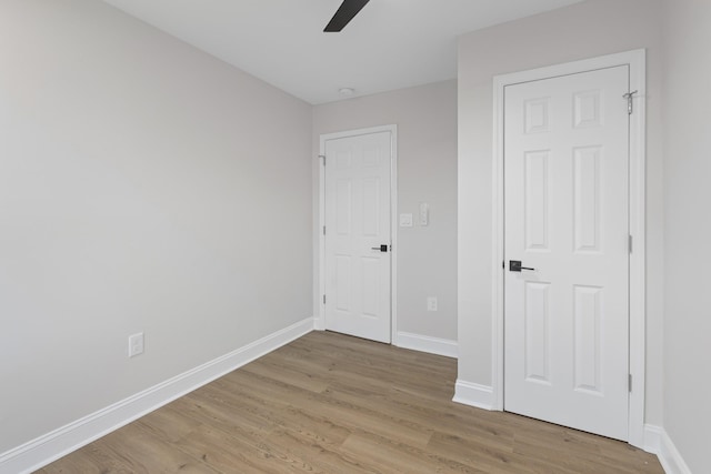 unfurnished bedroom featuring ceiling fan and light hardwood / wood-style flooring