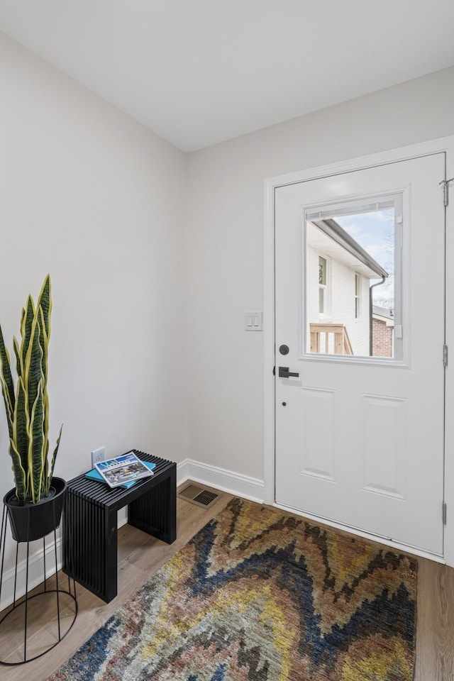 entrance foyer with hardwood / wood-style flooring