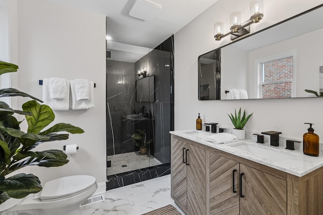 bathroom with a chandelier, vanity, a shower with shower door, and toilet