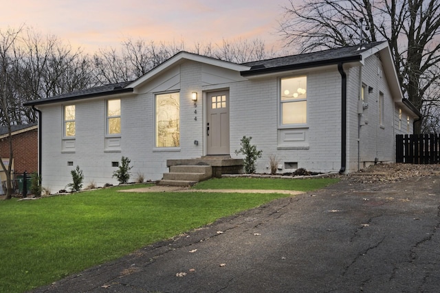 view of front of home with a yard