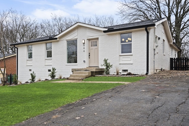 view of front of home with a front lawn