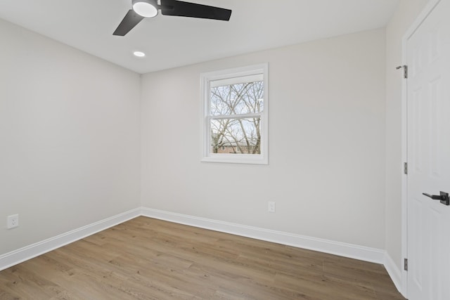 spare room with hardwood / wood-style flooring