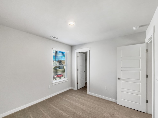 unfurnished bedroom with carpet floors