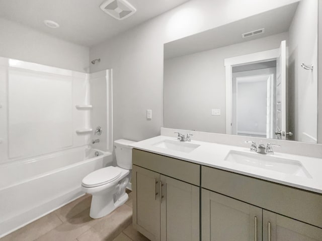 full bathroom with toilet, shower / tub combination, vanity, and tile patterned floors